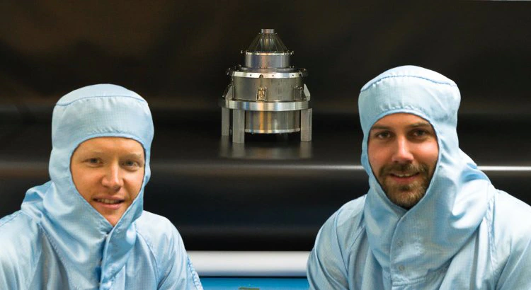 Rikard Ottemark and Joakim Peterson, both research engineers, in protective clothing, with JDC in the middle.