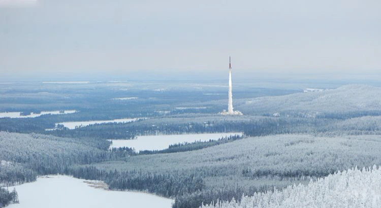 Esrange rocket launch as seen from distance, surrounded by a frosty winter landscape Esrange rocket launch as seen from distance, surrounded by a frosty winter landscape