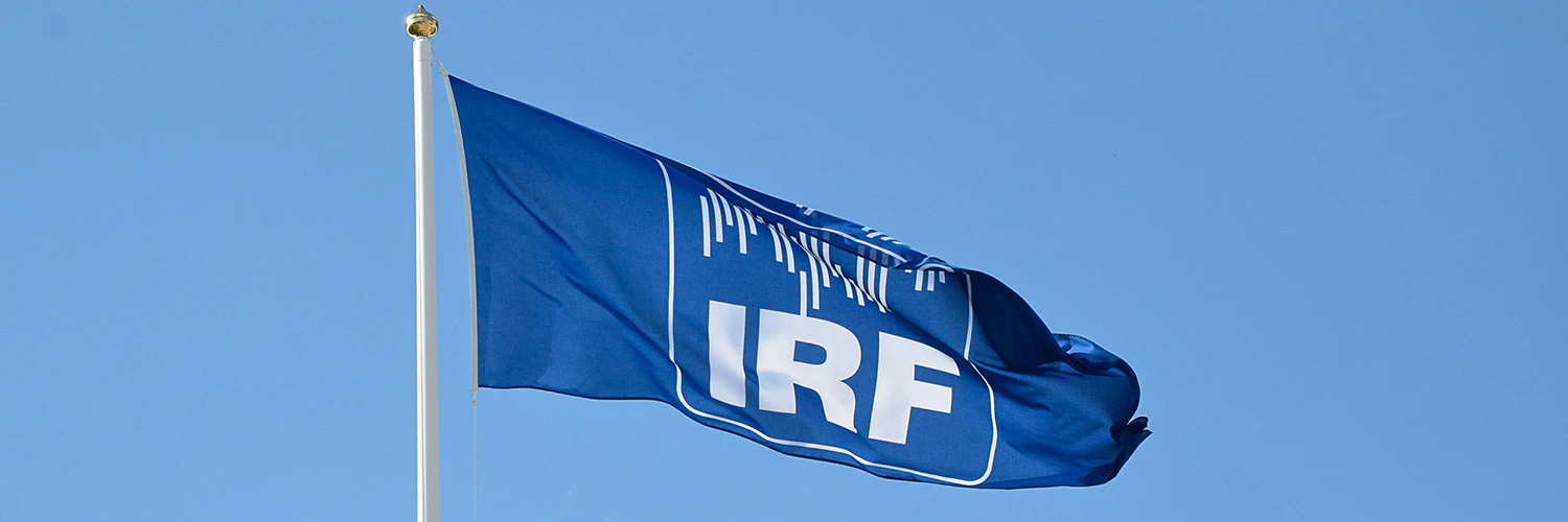 Flag with the IRF logo in the wind