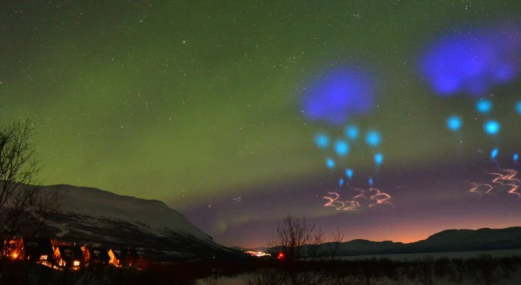 Colorful artificial clouds and regular aurora over mountains