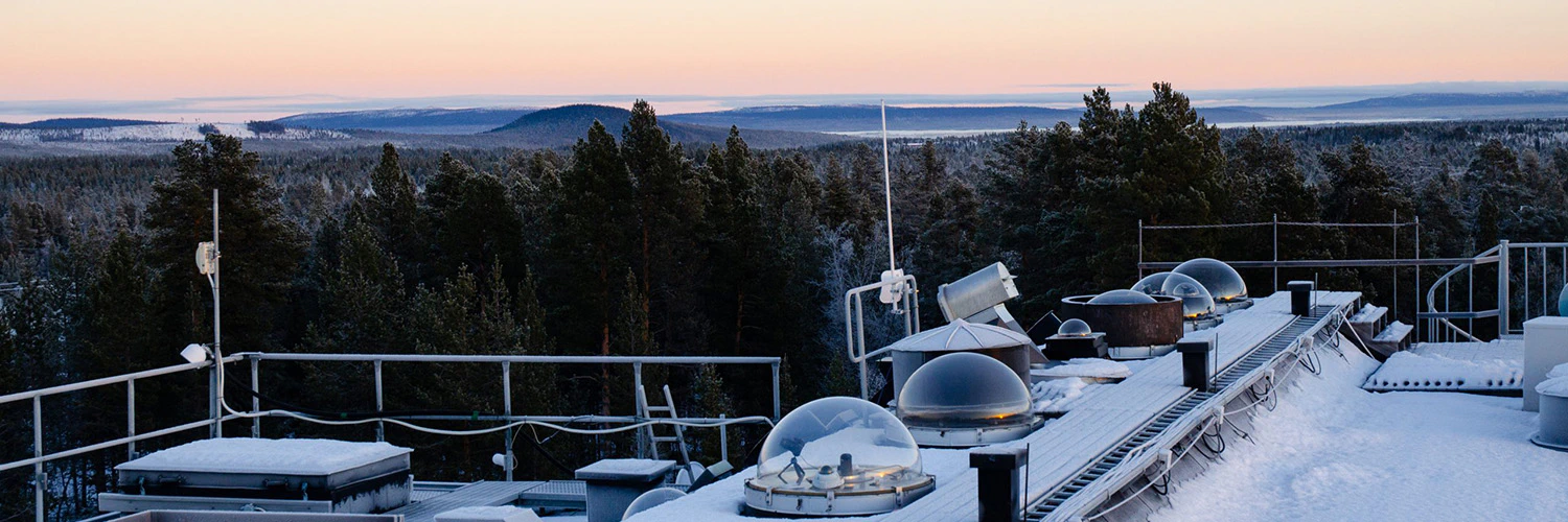 The optics lab in winter, with instruments underneath cupolas